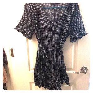 A black with white polka dot dress